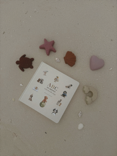 Child reading ABC the Alphabet with Doodle Dogs board book